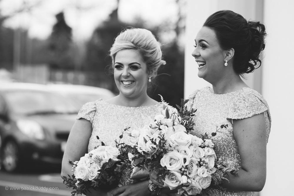 Black and white wedding photography bridesmaids after wedding ceremony in chapel, prior to wedding at Ballyscullion Park Wedding Venue by Patrick Duddy Documentary Candid Wedding Photography