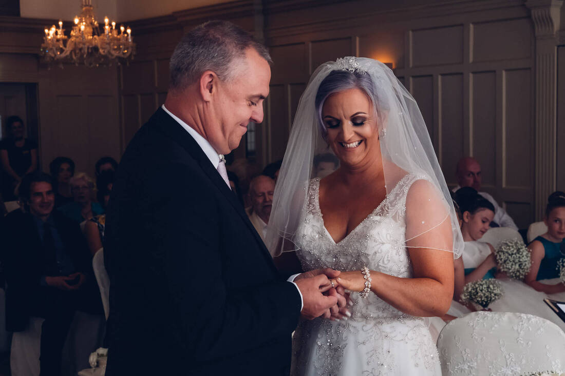 A candid, natural wedding photograph of Grainne and Andy during their Wedding Civil Ceremony at Bishops Gate Hotel Derry by Patrick Duddy Documentary Wedding Photography