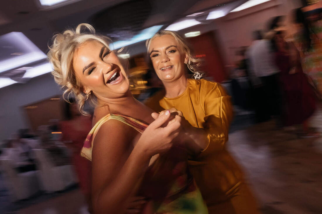 Two guests on the dancefloor at a wedding