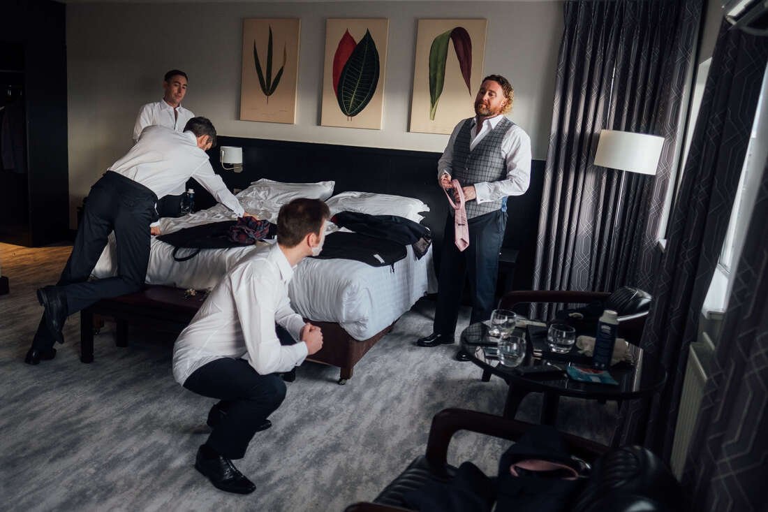 Grooms & Groomsmen getting ready in the Redcastle Hotel County Donegal Ireland prior to the wedding ceremony