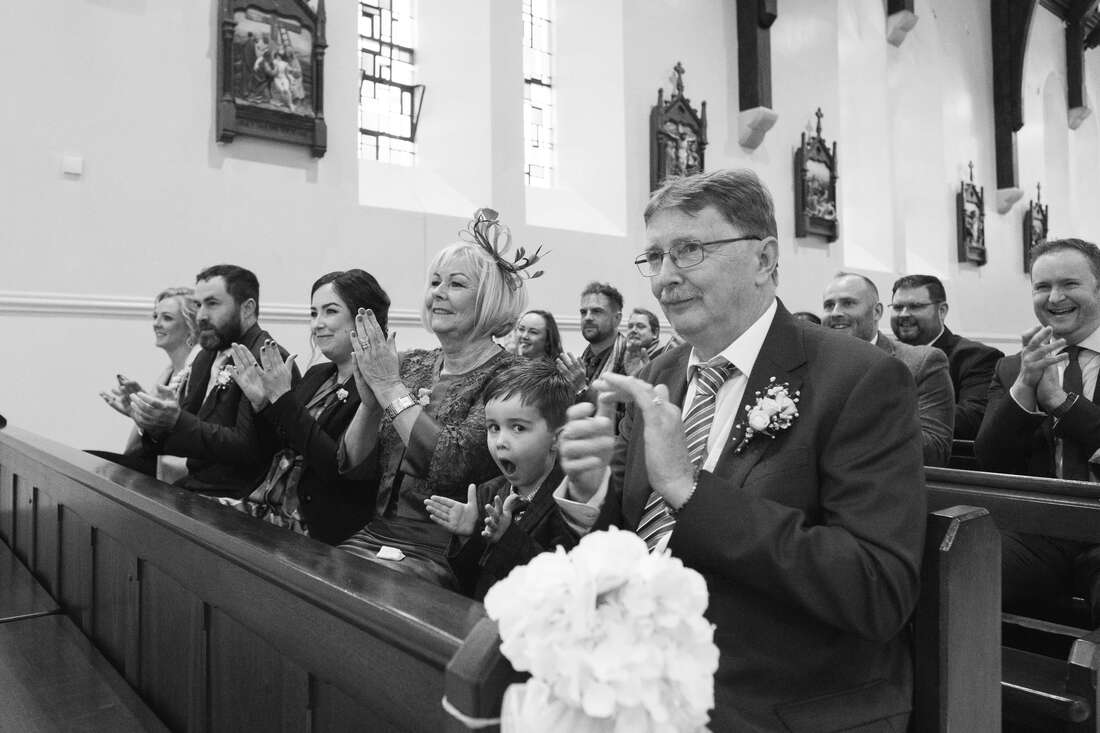 Photographs of the Bride, Groom, Priest and Guests during the Wedding Ceremony in Drung County Donegal Patrick Duddy wedding photography
