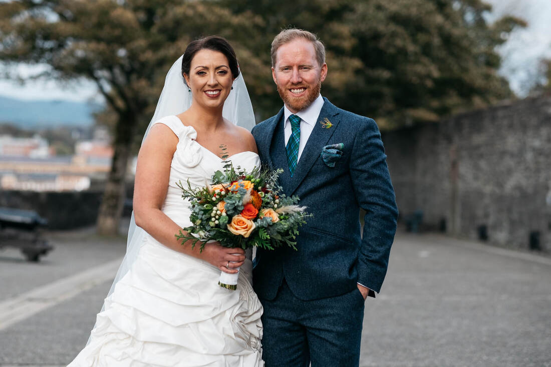 A bride and groom in Derry's Walls