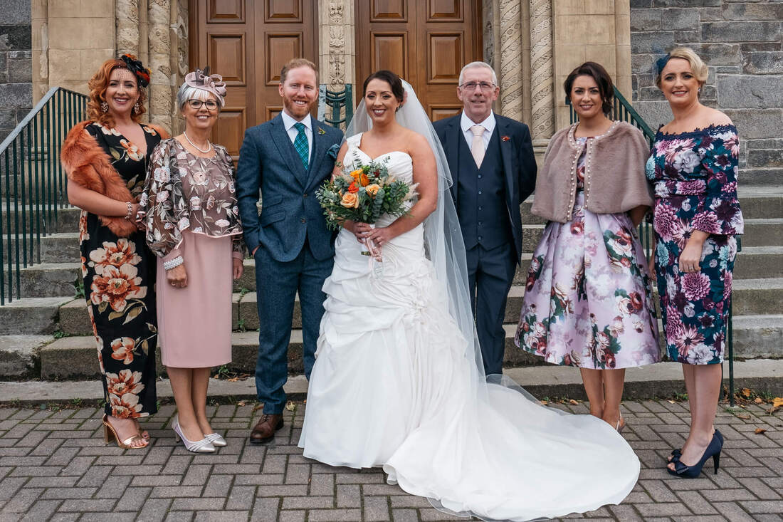 Bride with her Family and the Groom outside Long Tower Church Derry