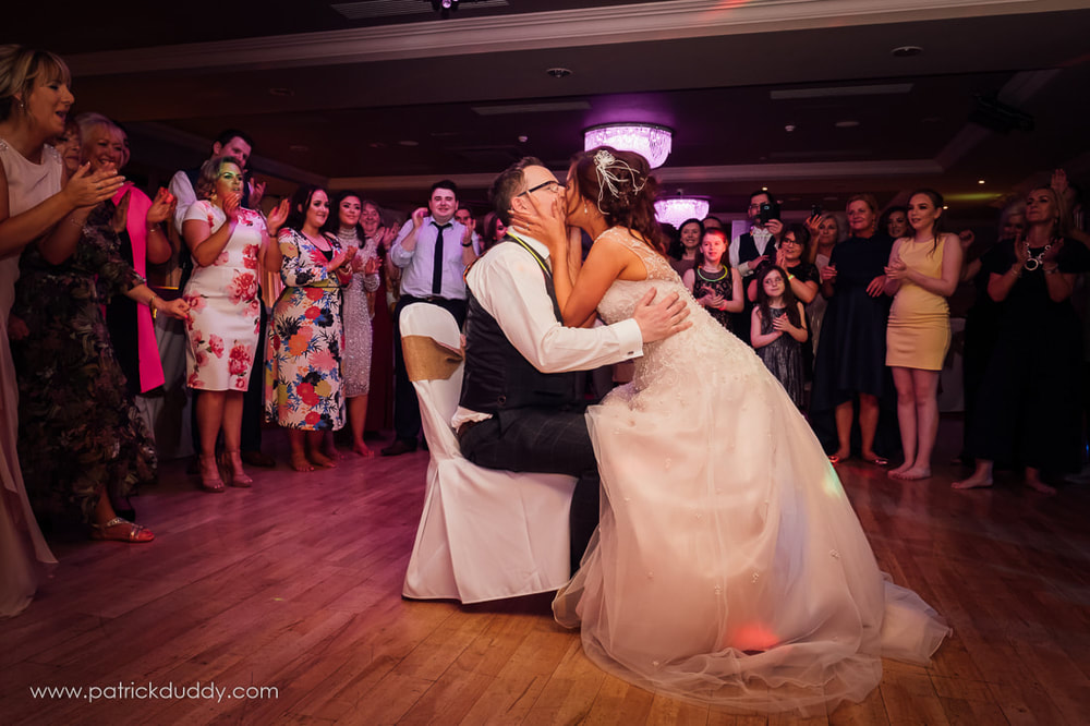 Bride and Groom share a kiss on the dance floor of the Ballyliffin Lodge Hotel in Country Donegal, Ireland