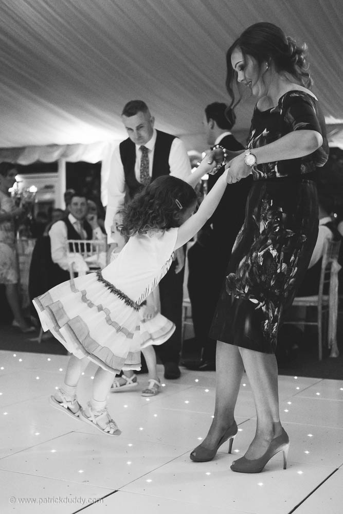 Black and white wedding photography of wedding dancing during Irish garden party wedding at Ballyscullion Park Wedding Venue by Patrick Duddy Documentary Candid Wedding Photography