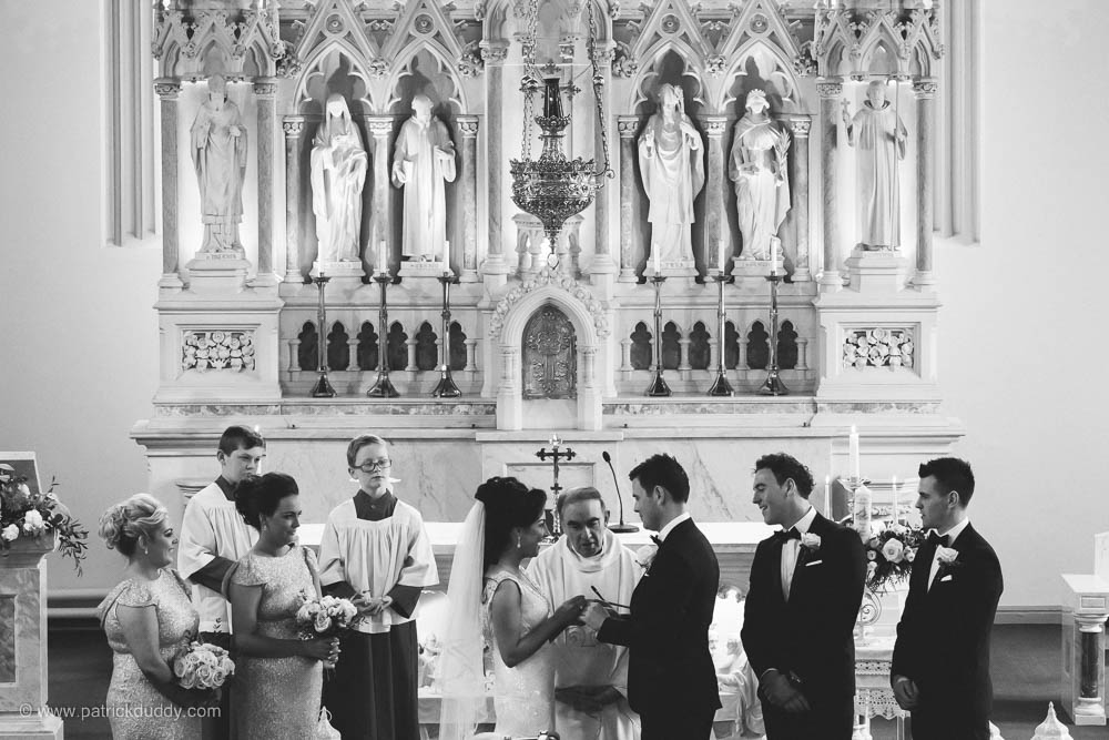 Black and white wedding photography o wedding ceremony in chapel, prior to wedding at Ballyscullion Park Wedding Venue by Patrick Duddy Documentary Candid Wedding Photography