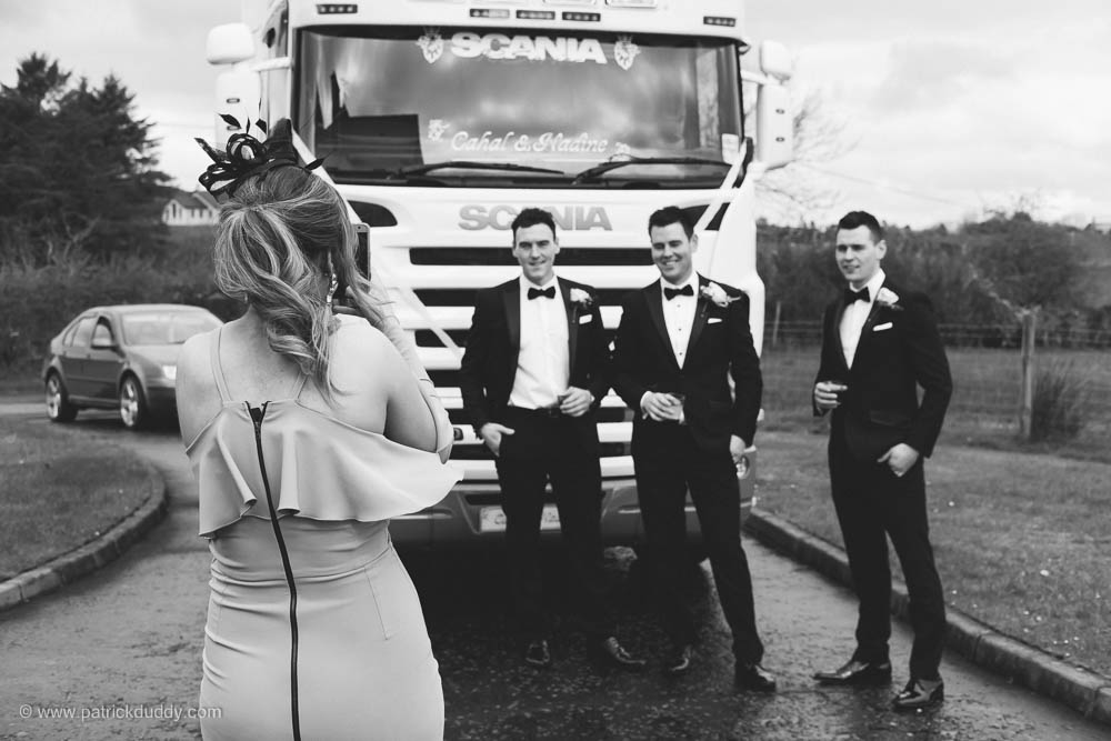 Black and white wedding photograph of groom & groomsmen prior to Ballyscullion Park Wedding Venue by Patrick Duddy Candid & Documentary Wedding Photography