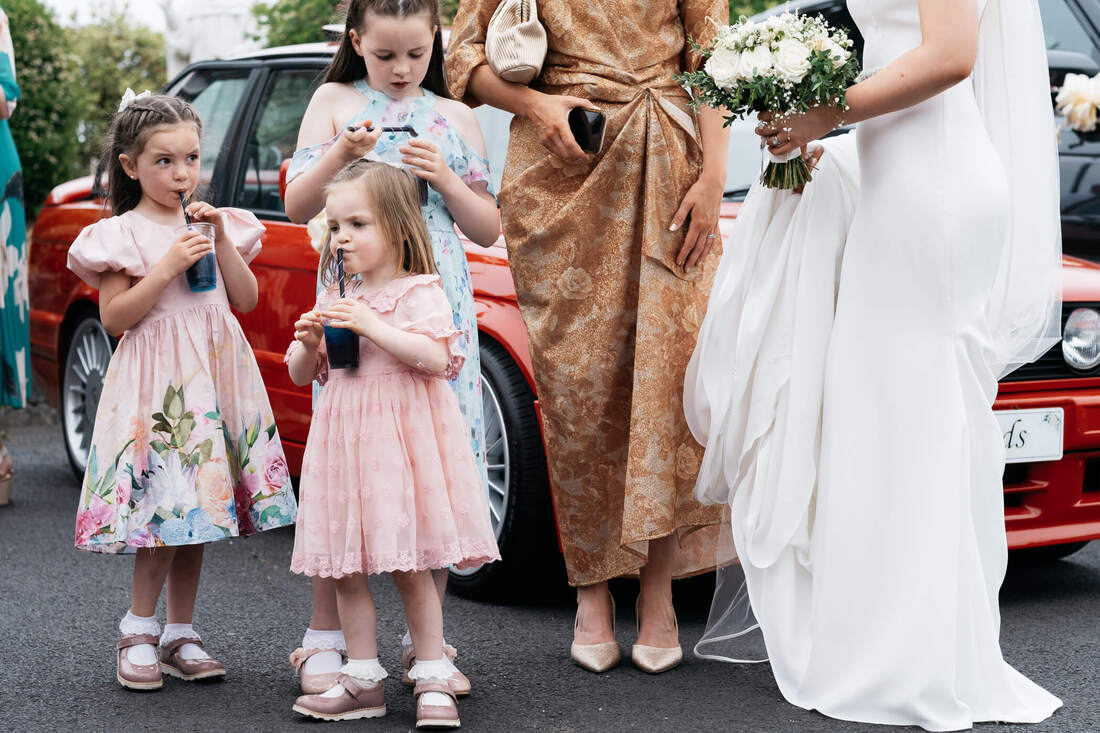 Young Wedding Guests enjoying refreshments from an ice-cream van outside a Donegal Summer Wedding