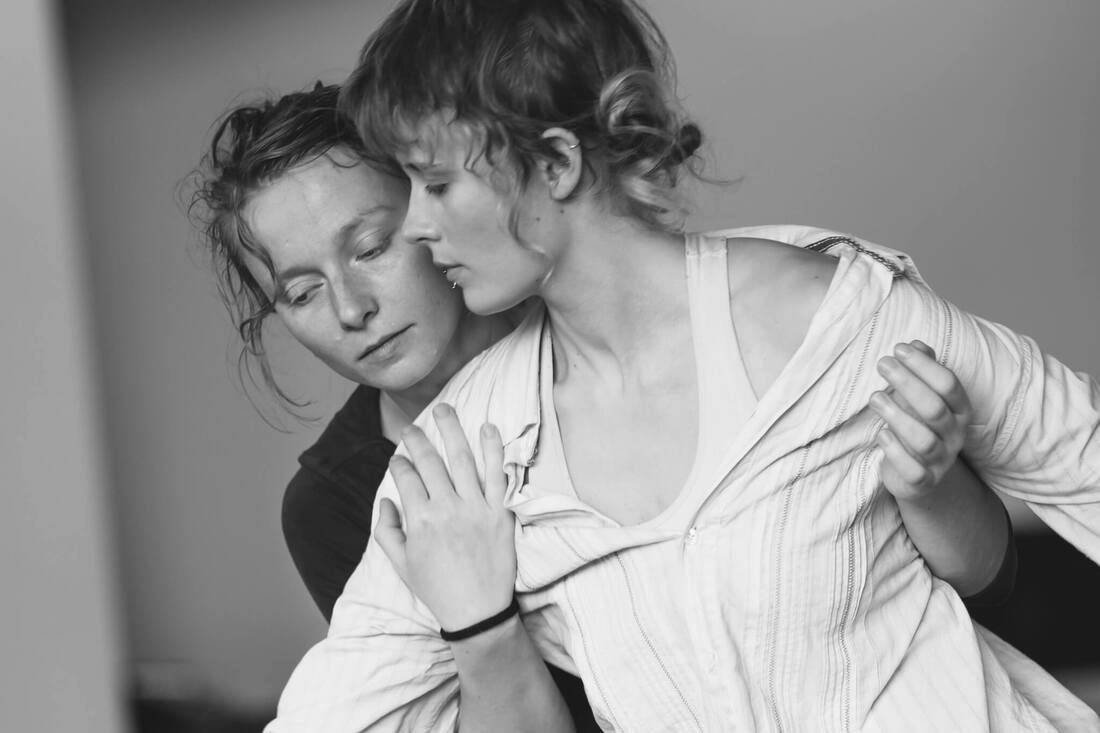 Two dancers interact during an Echo Echo festival workshop