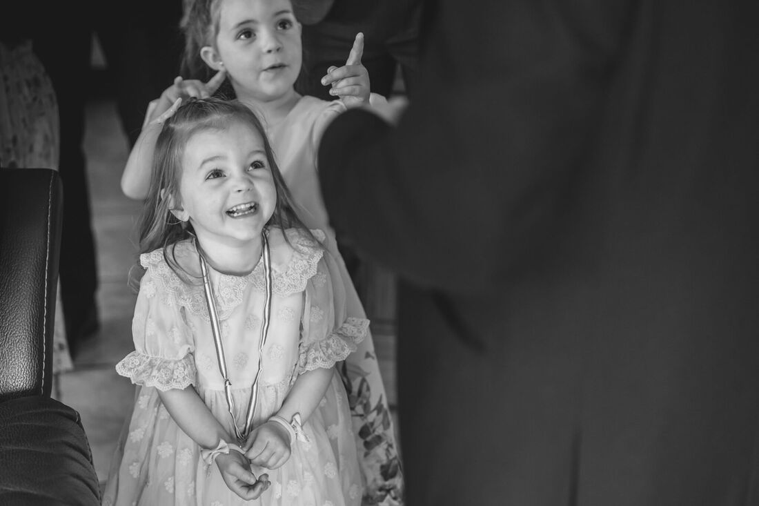Young girls greet their uncle on the day of his wedding
