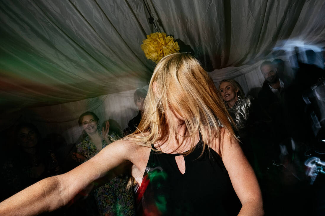 Birthday party dancefloor moves leave a party goer hiding behind their own hair