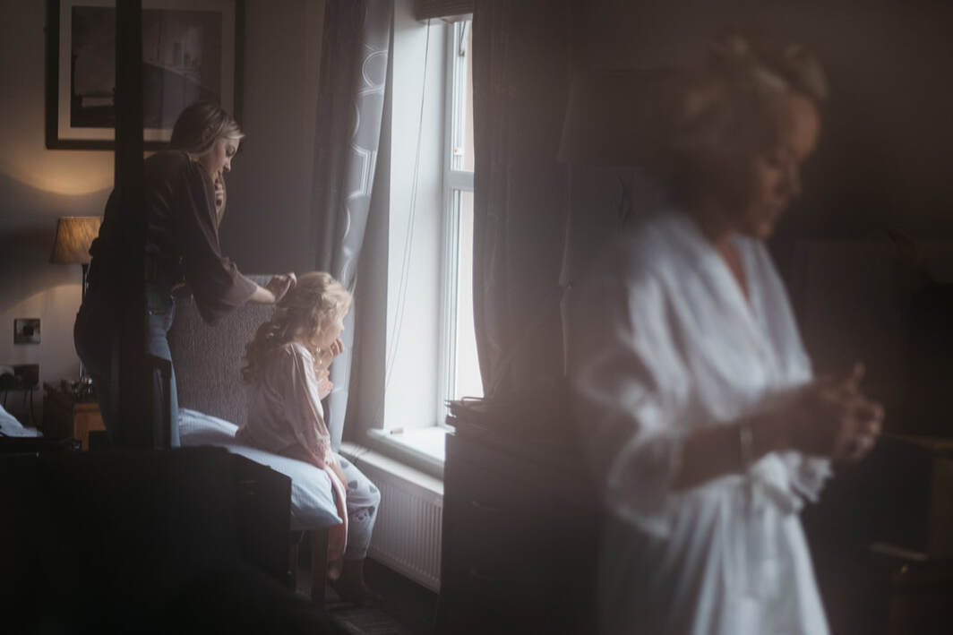 Bride and flower girl photographed during morning bridal prep at Redcastle Hotel Wedding Donegal by Patrick Duddy Wedding Photography Derry 