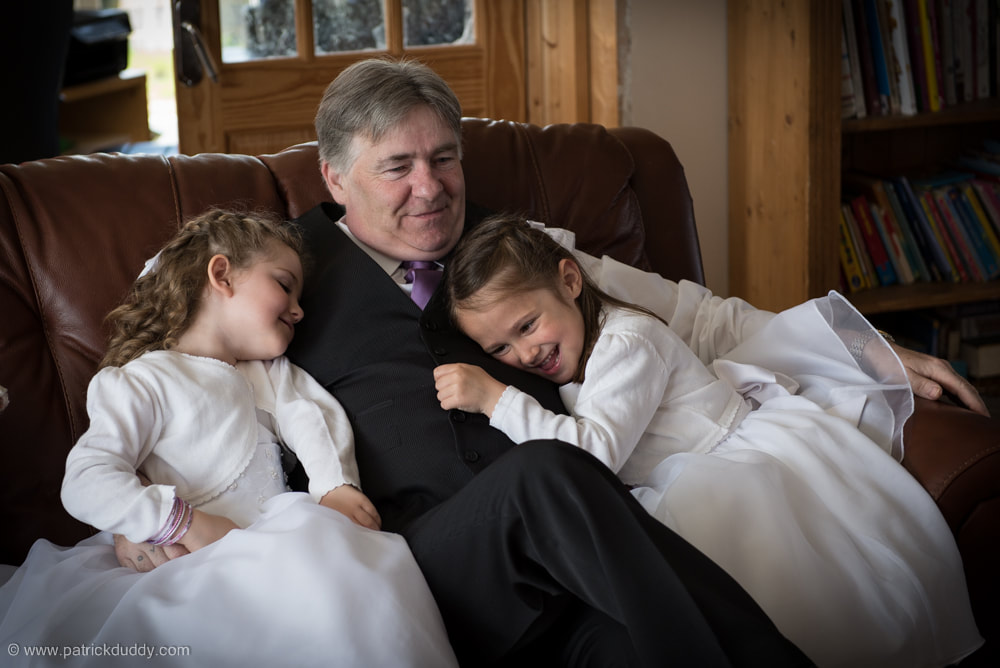 Father of the Bride, and Granda sharing some quiet time with the flowers girls prior to a Redcastle Hotel Wedding